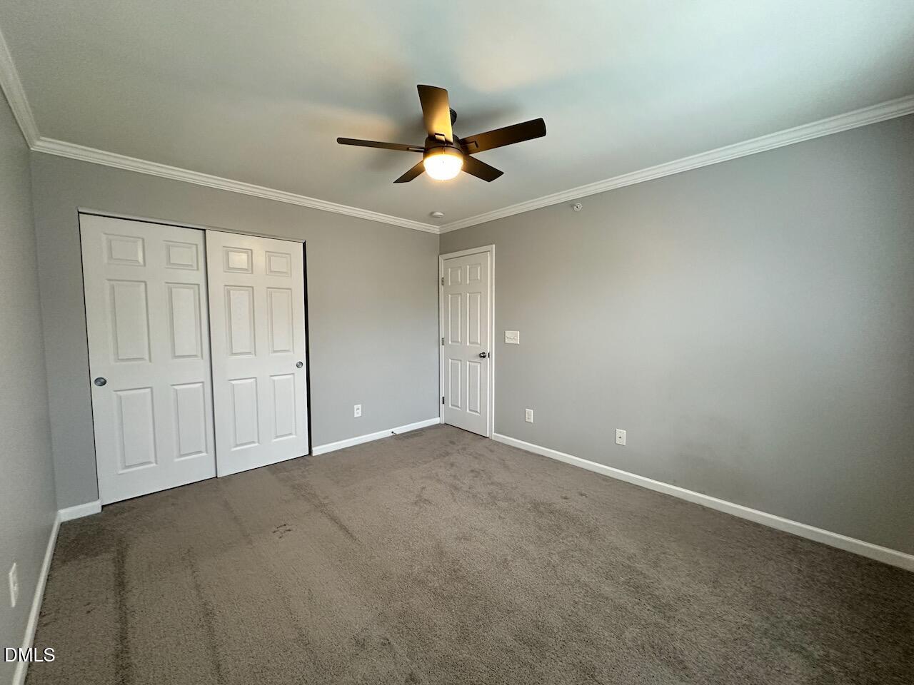 2705 Casper Creek Lane Raleigh, NC 27616 - Photo 21 of 35 an empty room with windows and fan