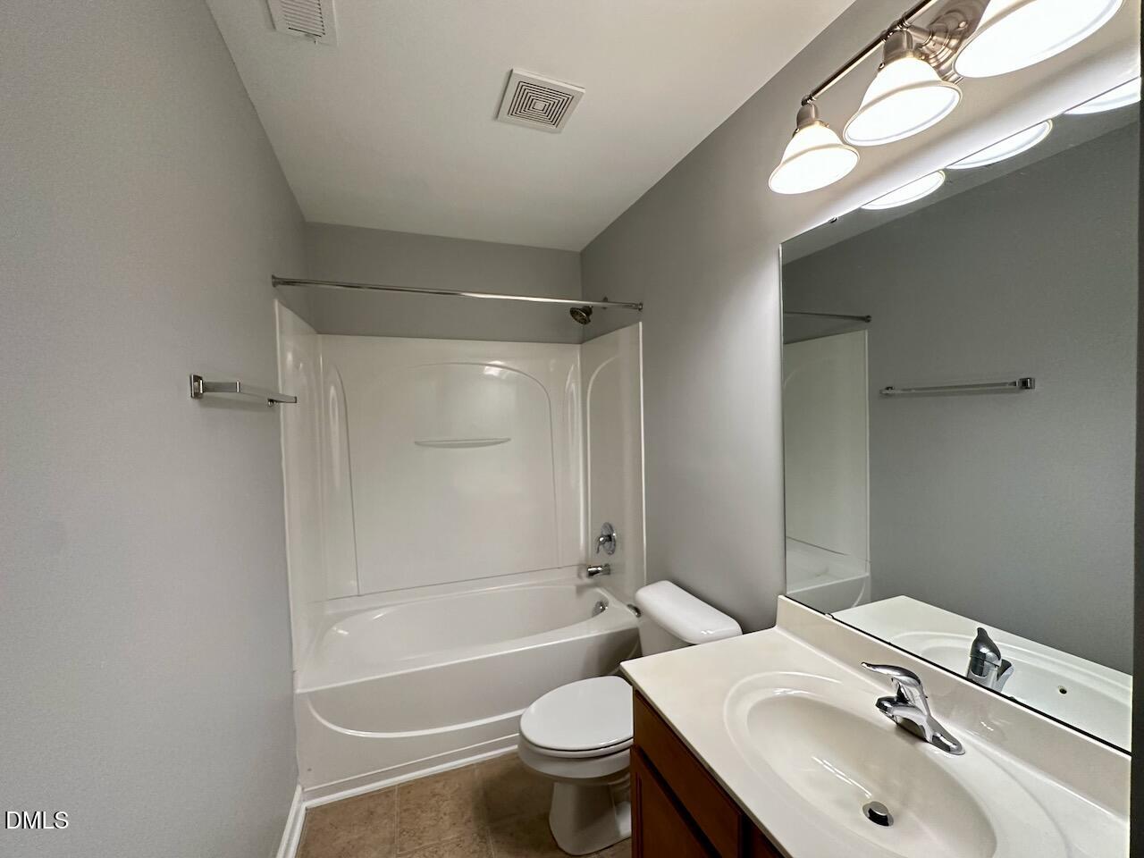 2705 Casper Creek Lane Raleigh, NC 27616 - Photo 22 of 35 a bathroom with a sink toilet and shower
