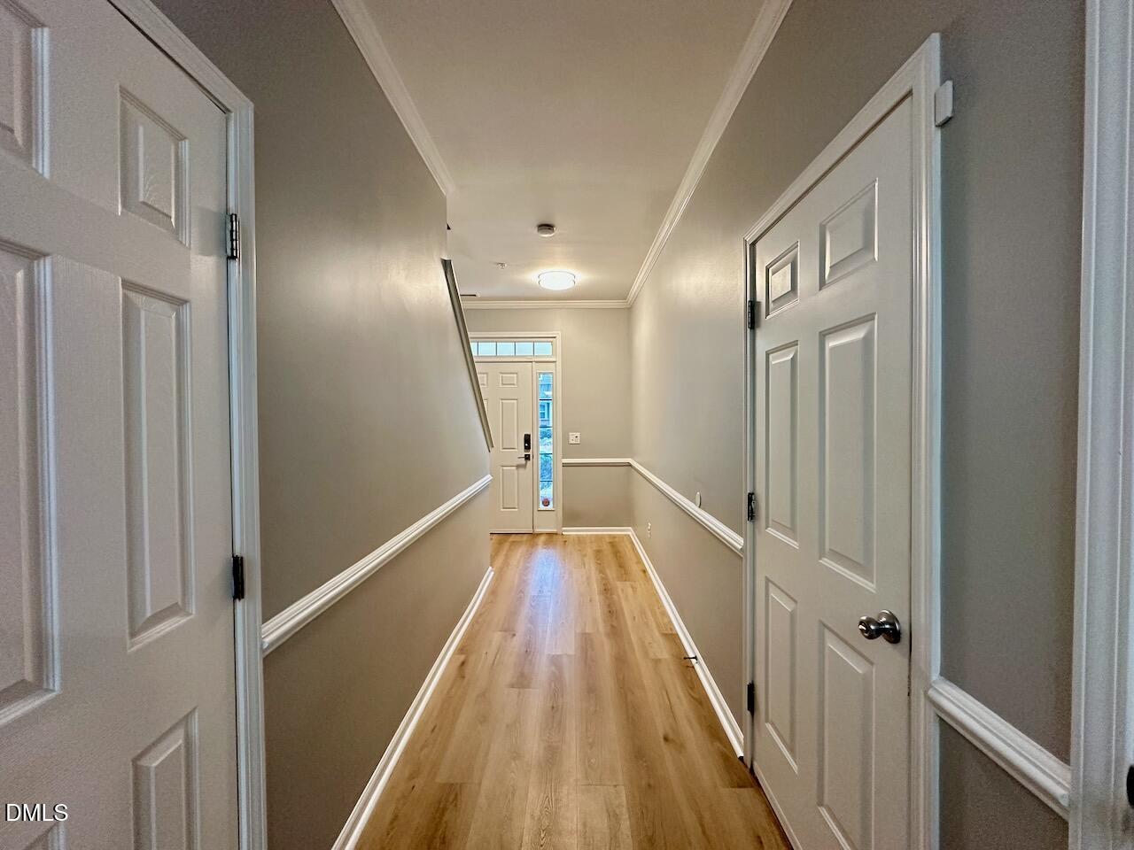 2705 Casper Creek Lane Raleigh, NC 27616 - Photo 3 of 35 a view of a hallway with wooden floor and staircase