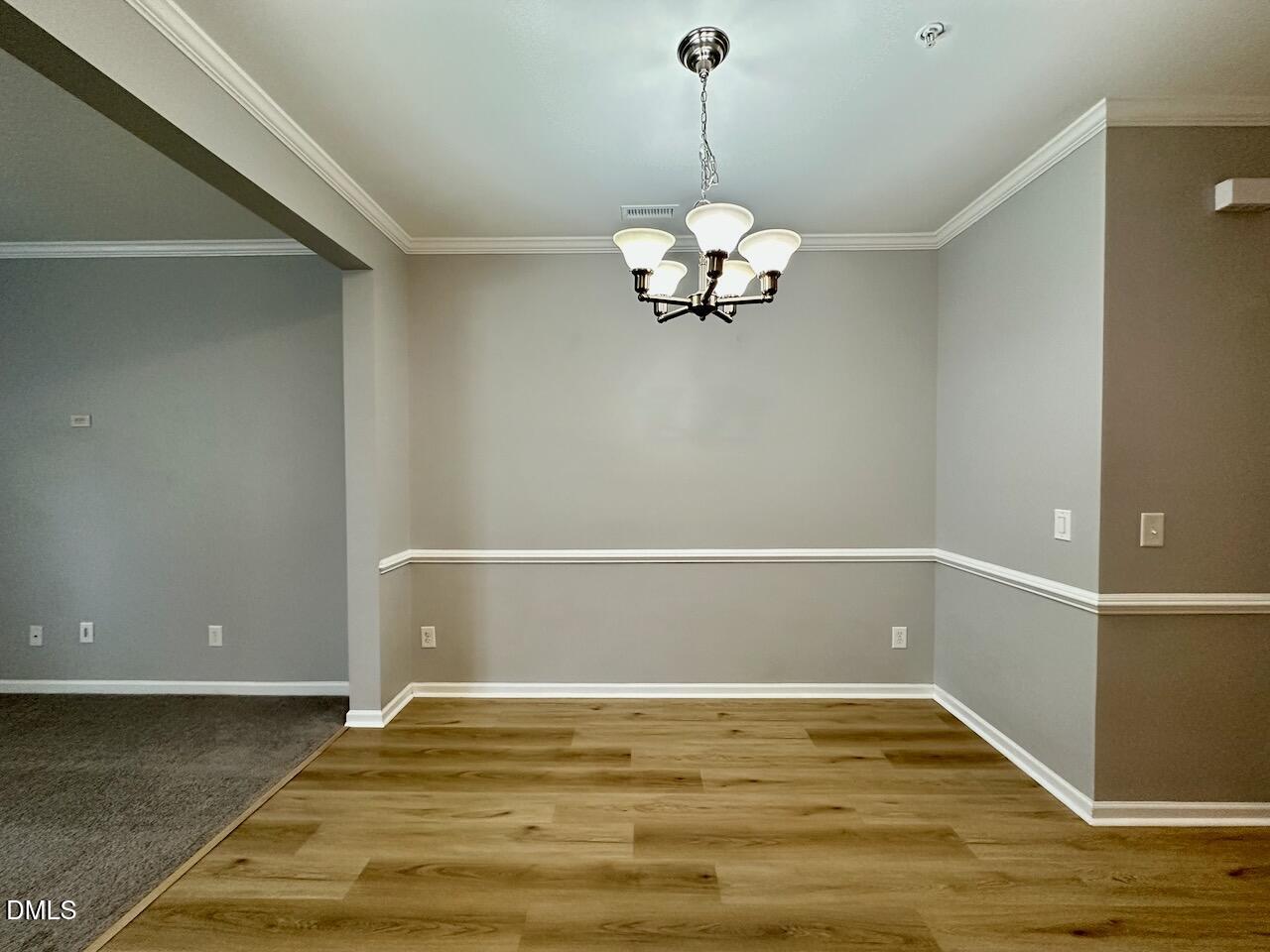 2705 Casper Creek Lane Raleigh, NC 27616 - Photo 5 of 35 a view of empty room with wooden floor