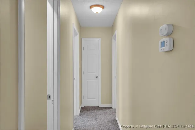 a view of a livingroom and a bathroom with sink