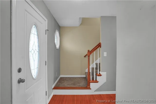 a view of staircase with white walls
