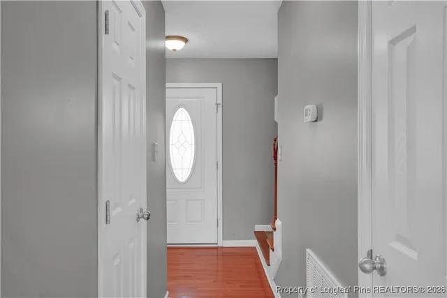 a view of a bathroom with wooden floor