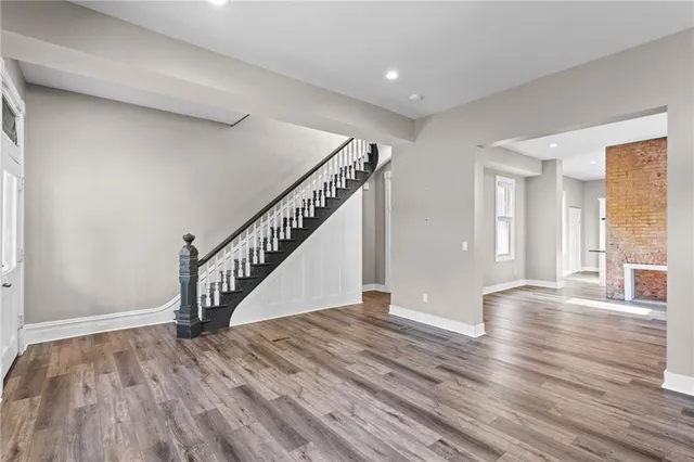 a view of an entryway with wooden floor