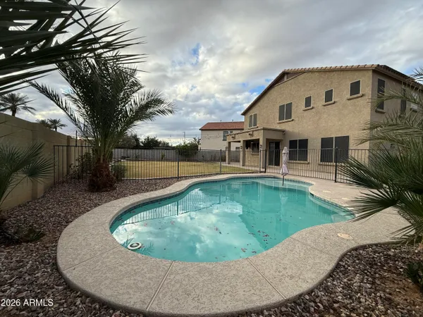 a view of a house with swimming pool