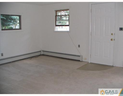 1597 Holly Road North Brunswick, NJ 08902 - Photo 6 of 9 an empty room with a window
