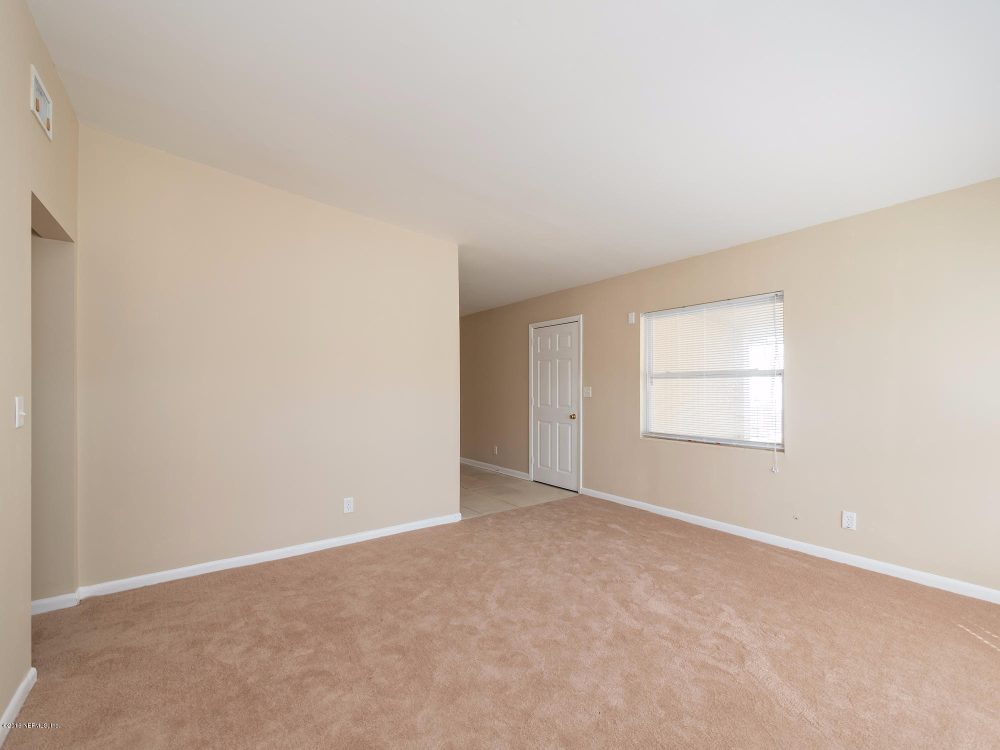10474 Dodd Road Jacksonville, FL 32218 - Photo 4 of 26 an empty room with a window