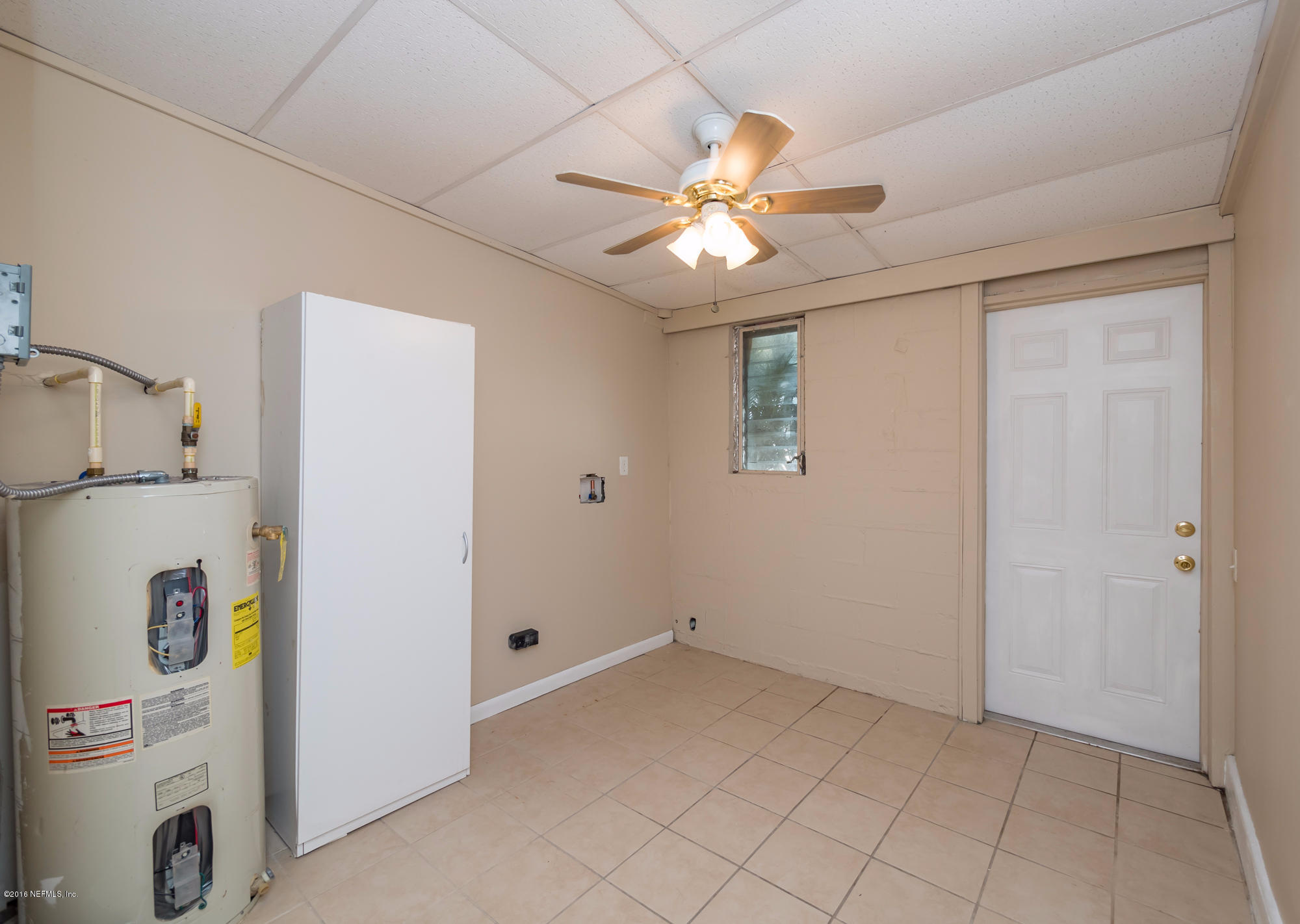 10474 Dodd Road Jacksonville, FL 32218 - Photo 8 of 26 a view of a storage & utility room with a window