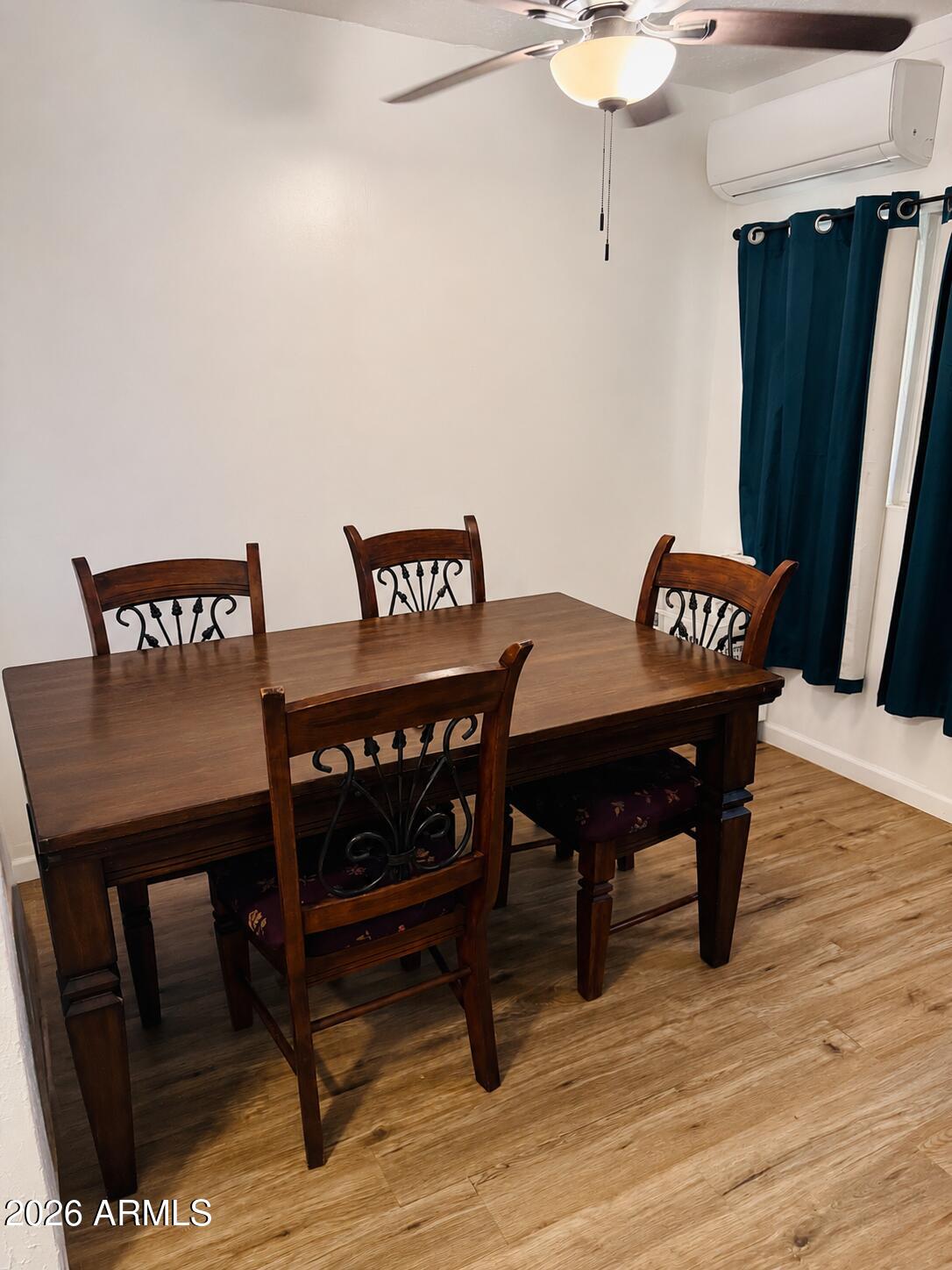 701 6th Green Street Douglas, AZ 85607 - Photo 5 of 10 a view of a table and chairs in wooden floor