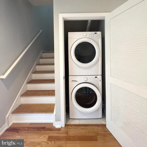 a view of a hallway with washer and dryer