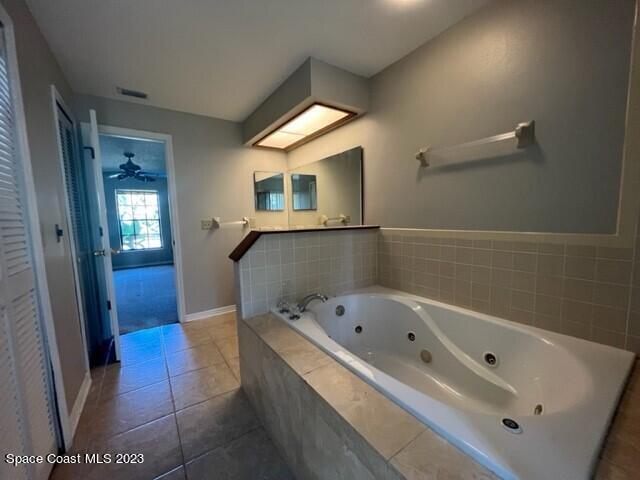 4795 Riverside Road Palm Shores, FL 32935 - Photo 15 of 33 a bathroom with a bathtub and a shower