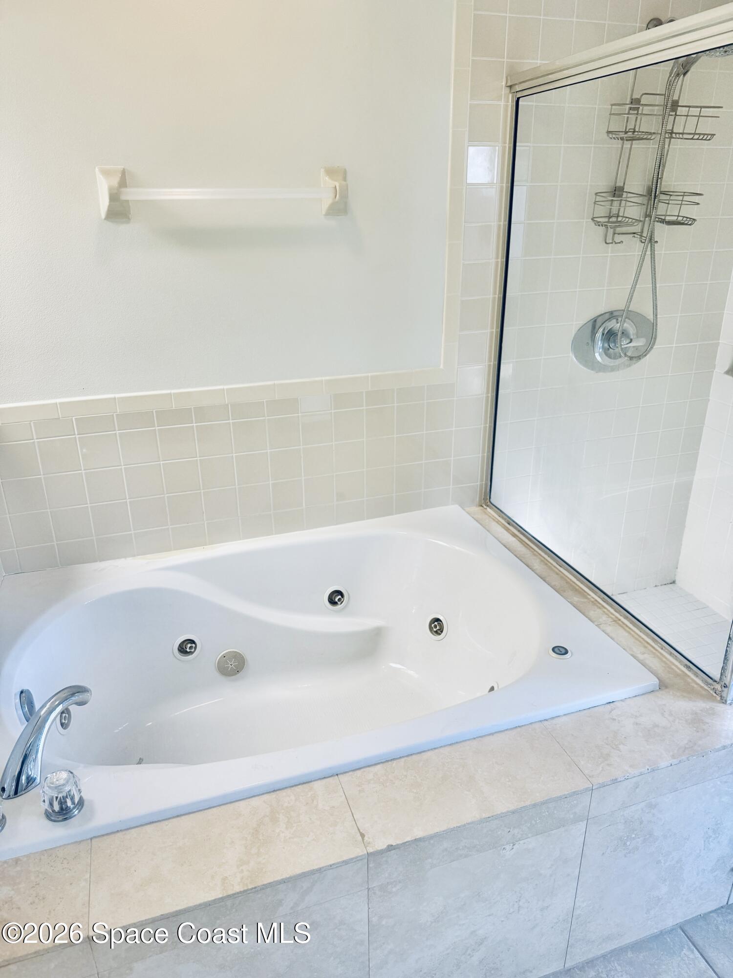 4795 Riverside Road Palm Shores, FL 32935 - Photo 16 of 33 a bathroom with a tub a sink and shower