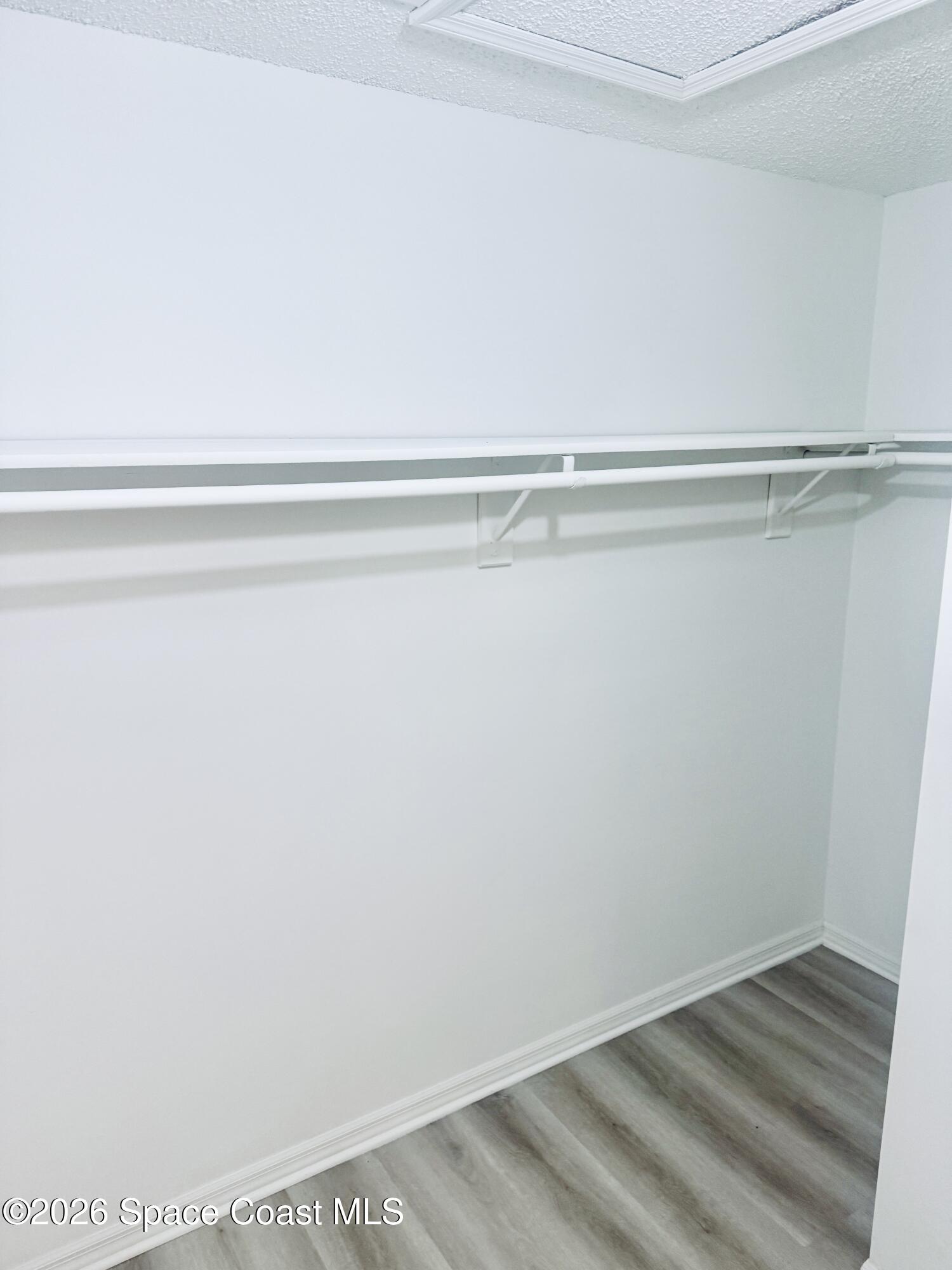 4795 Riverside Road Palm Shores, FL 32935 - Photo 17 of 33 a view of a closet with wooden floor