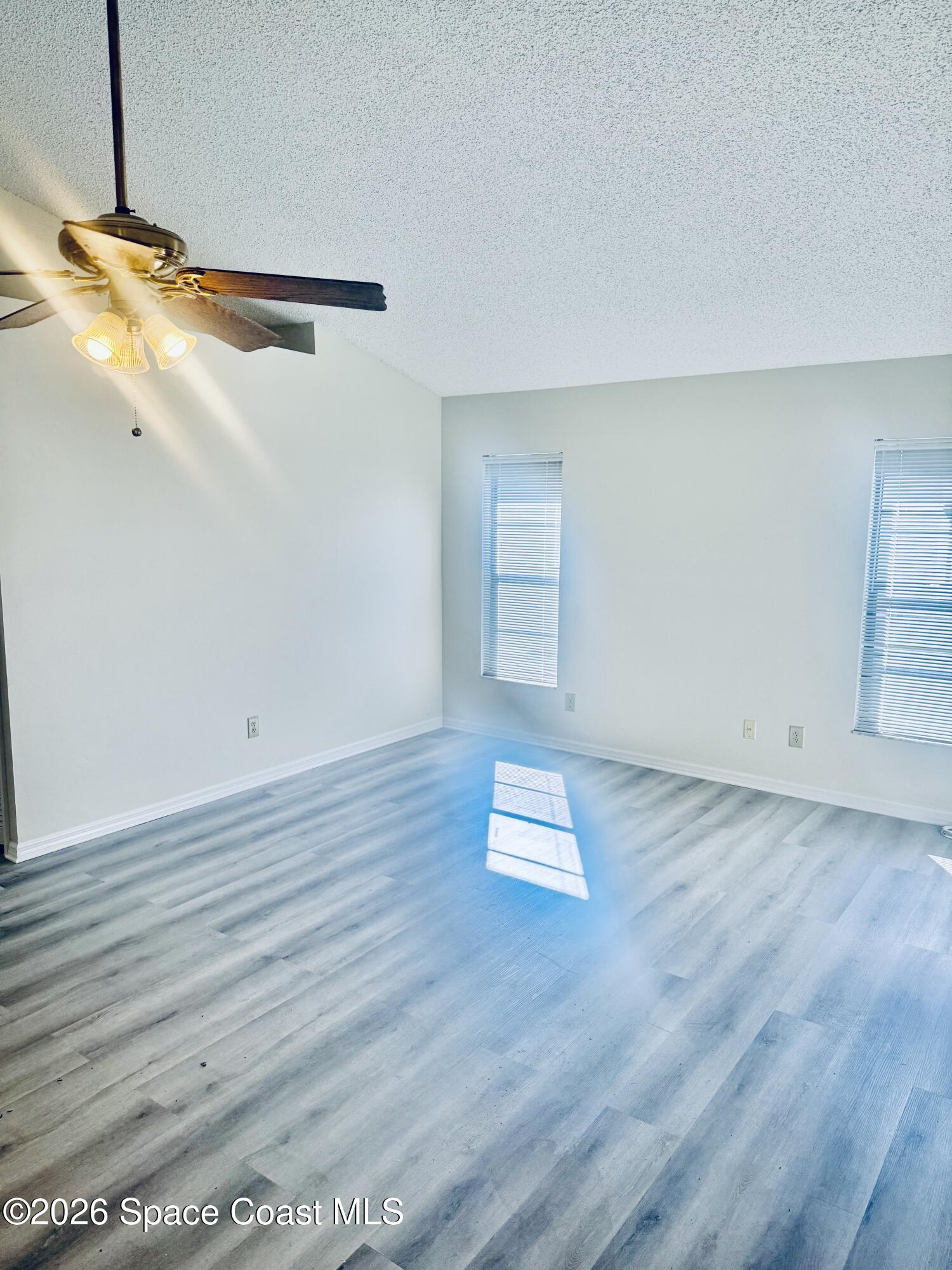 4795 Riverside Road Palm Shores, FL 32935 - Photo 18 of 33 a view of a room with wooden floor and white walls