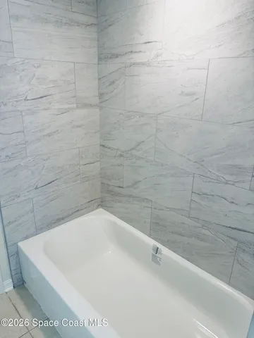 a view of a bathtub in a bathroom