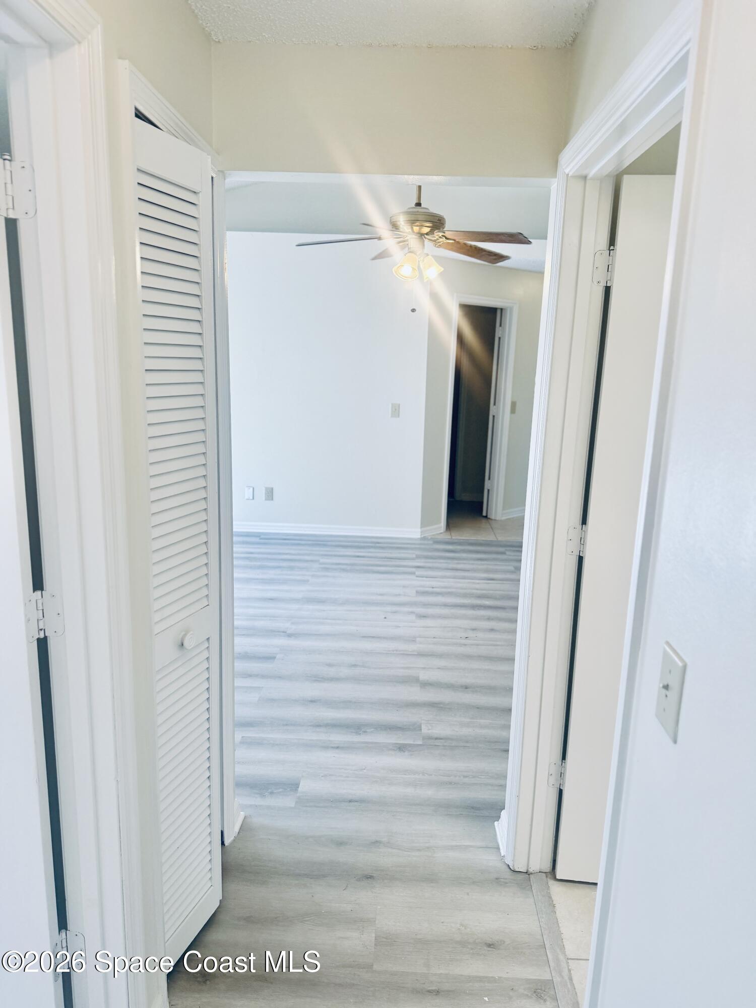 4795 Riverside Road Palm Shores, FL 32935 - Photo 25 of 33 a view of a hallway with wooden walls
