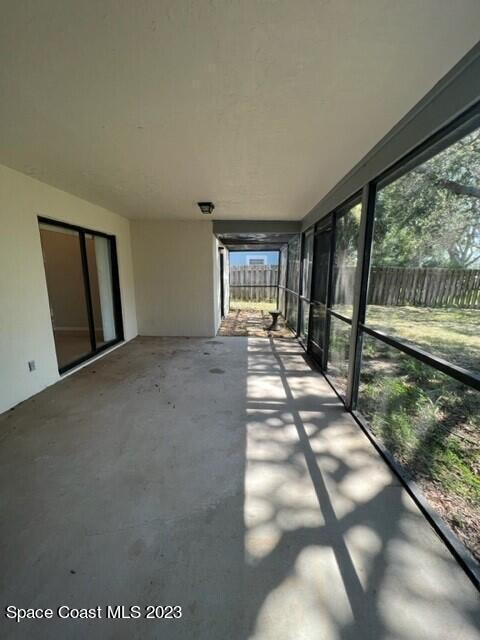 4795 Riverside Road Palm Shores, FL 32935 - Photo 28 of 33 a view of an empty room and floor to ceiling window