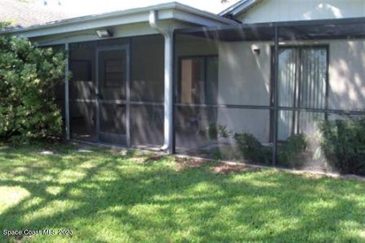 4795 Riverside Road Palm Shores, FL 32935 - Photo 30 of 33 a backyard of a house with lots of green space