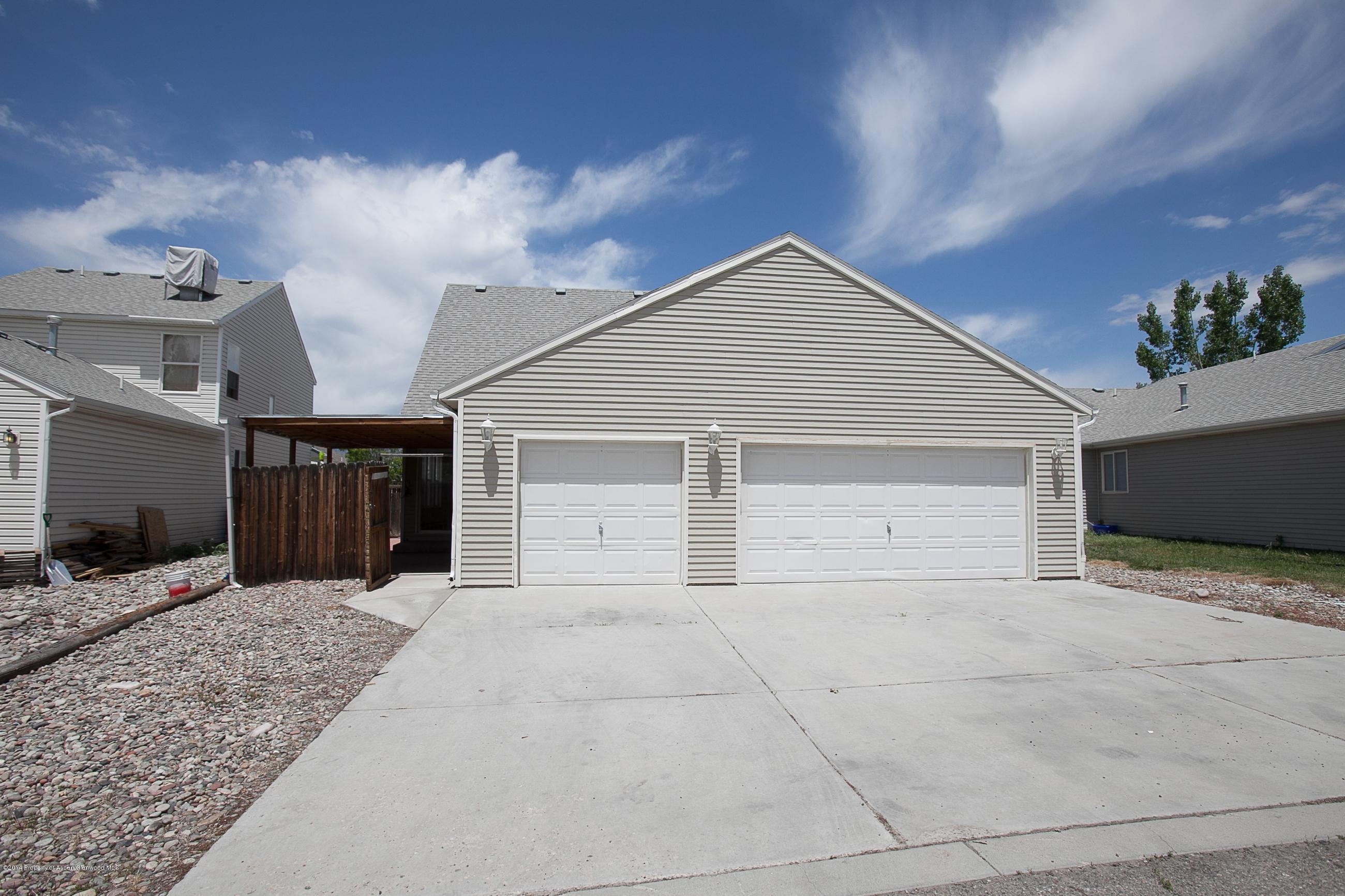 413 Evergreen Drive Rifle, CO 81650 - Photo 19 of 19 a view of a house with a garage