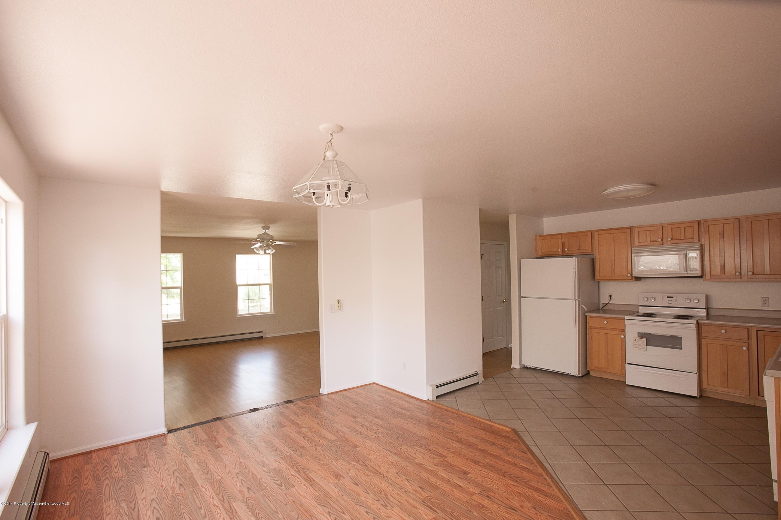 413 Evergreen Drive Rifle, CO 81650 - Photo 2 of 19 a view of a kitchen cabinets and a stove top oven
