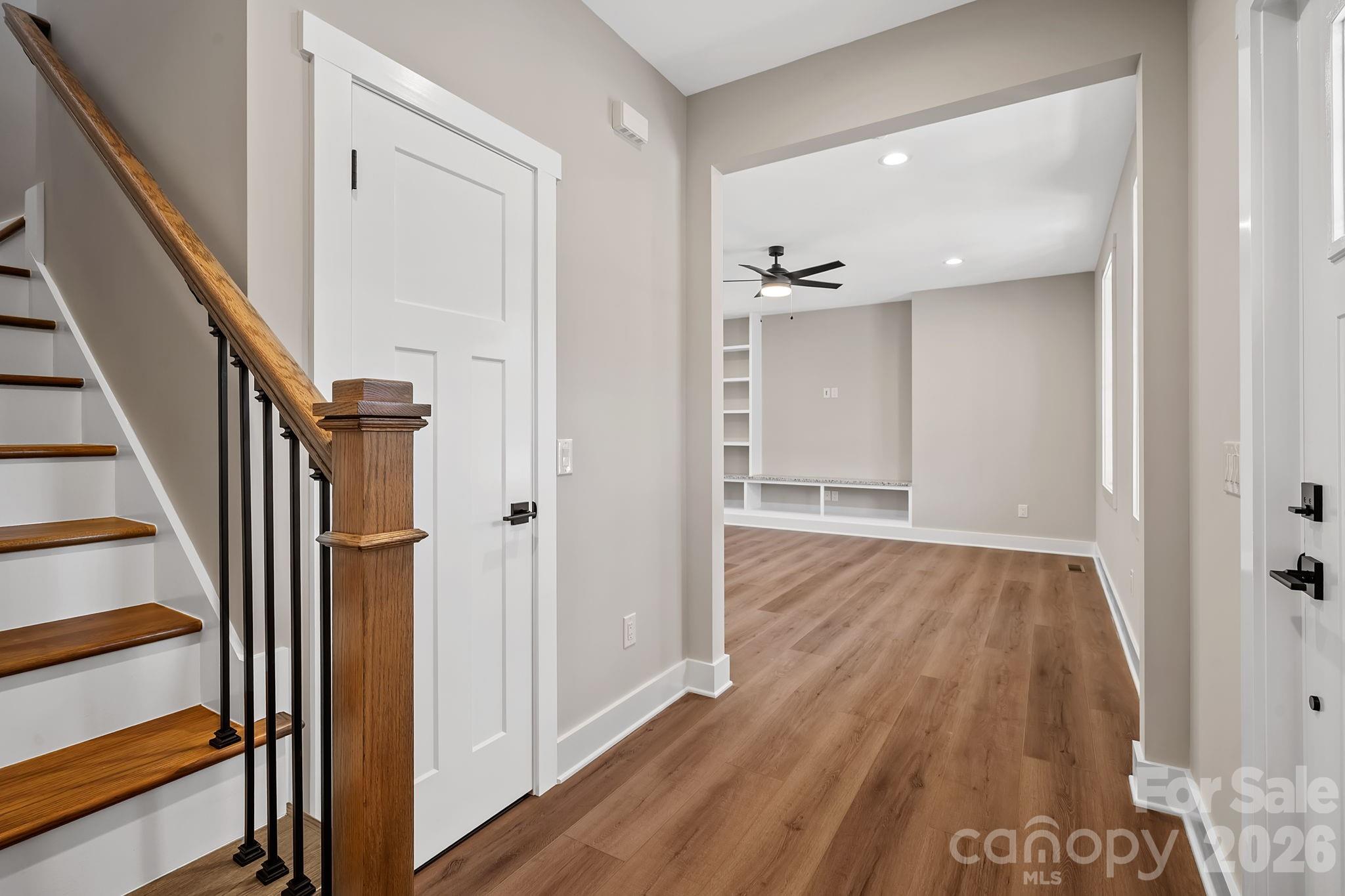 343 Olivette Road Asheville, NC 28804 - Photo 13 of 29 a view of a hallway with wooden floor and staircase