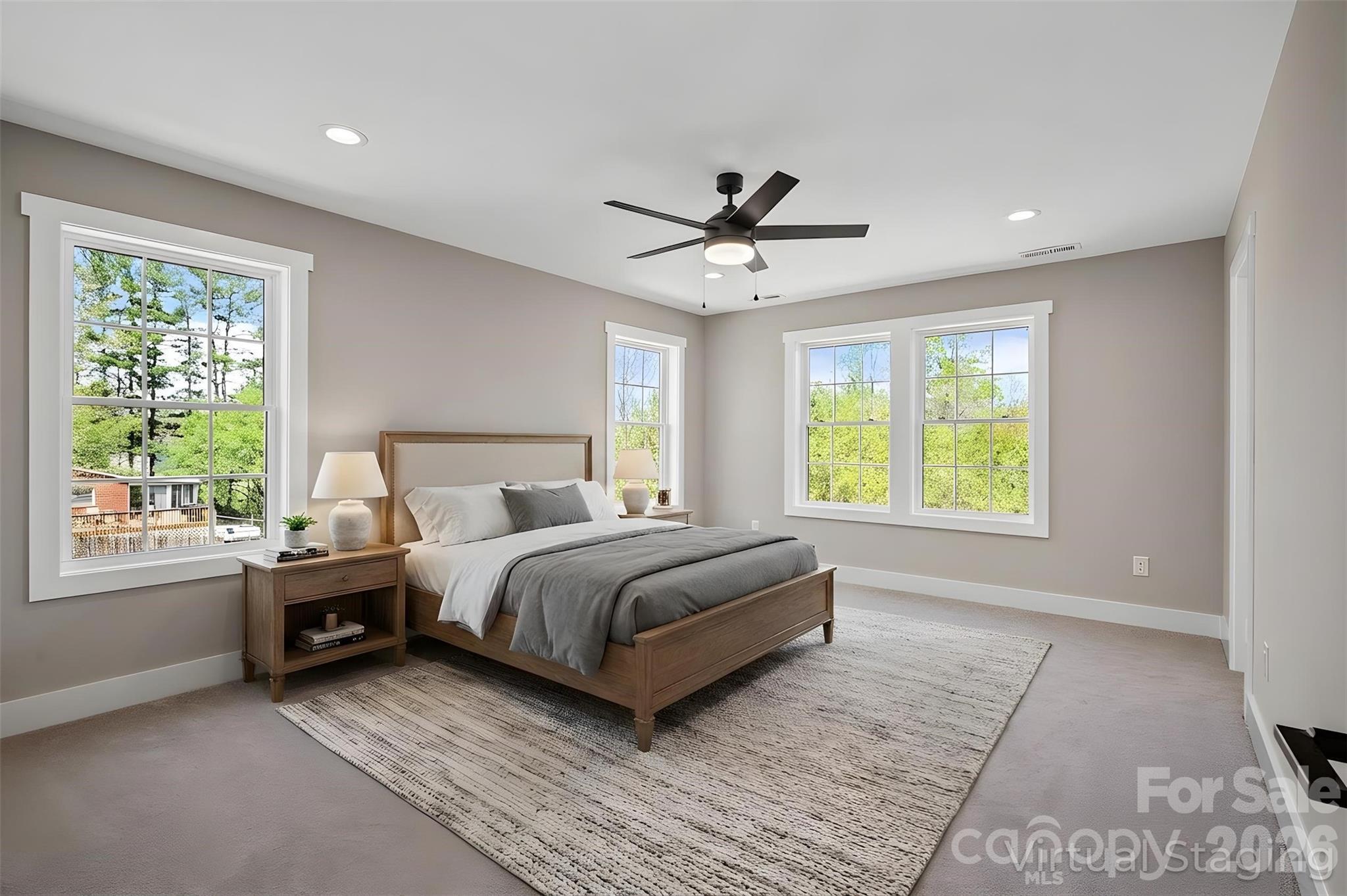 343 Olivette Road Asheville, NC 28804 - Photo 14 of 29 a spacious bedroom with a large bed and a window