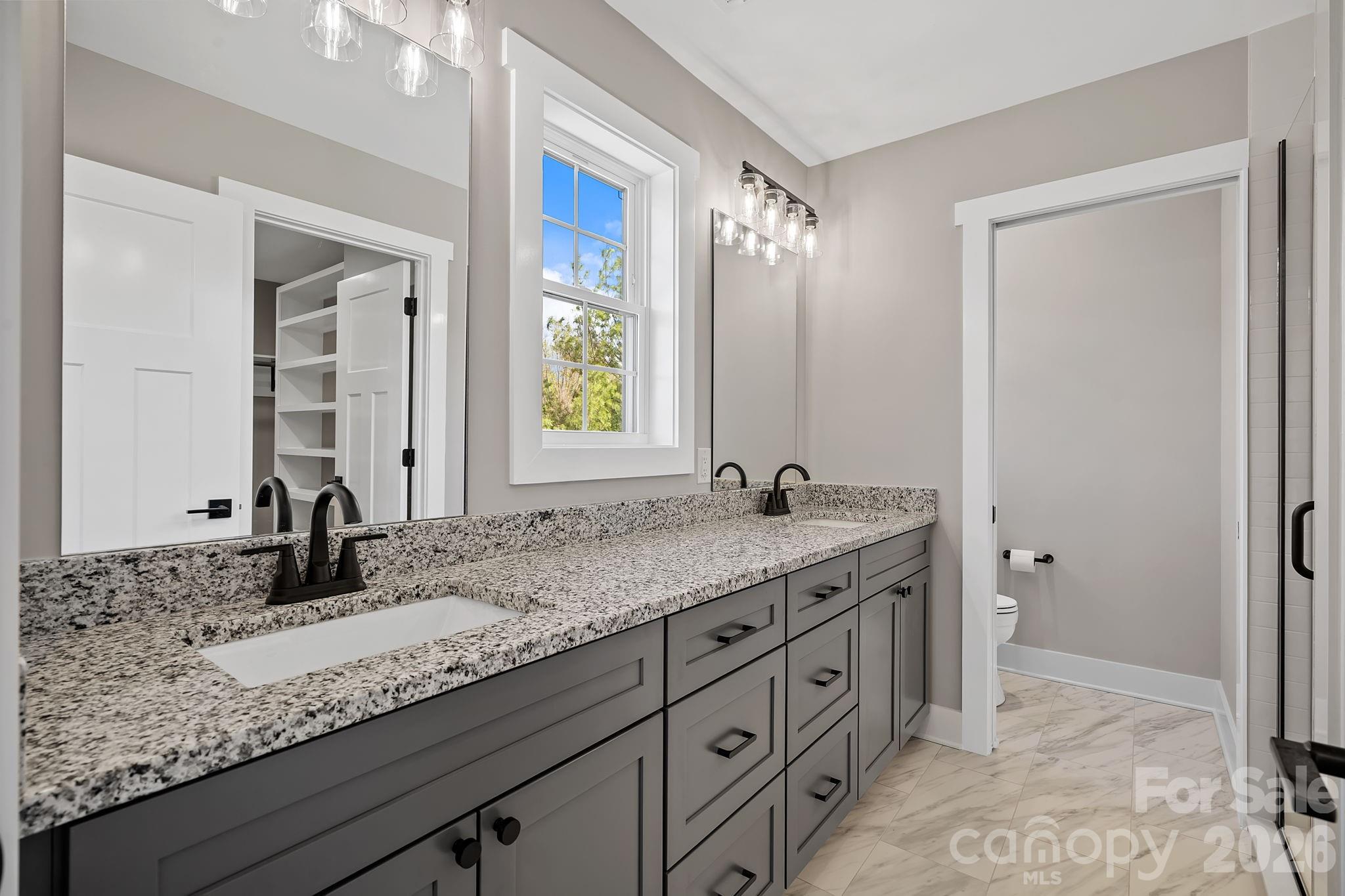343 Olivette Road Asheville, NC 28804 - Photo 16 of 29 a bathroom with a granite countertop sink and a mirror