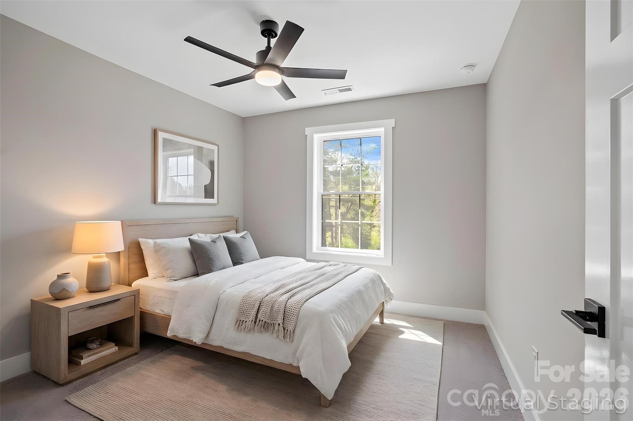 343 Olivette Road Asheville, NC 28804 - Photo 20 of 29 a bedroom with a bed and a window