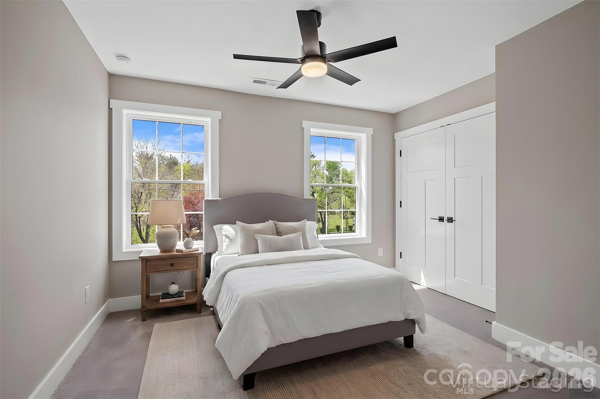 343 Olivette Road Asheville, NC 28804 - Photo 21 of 29 a bedroom with a bed and a window