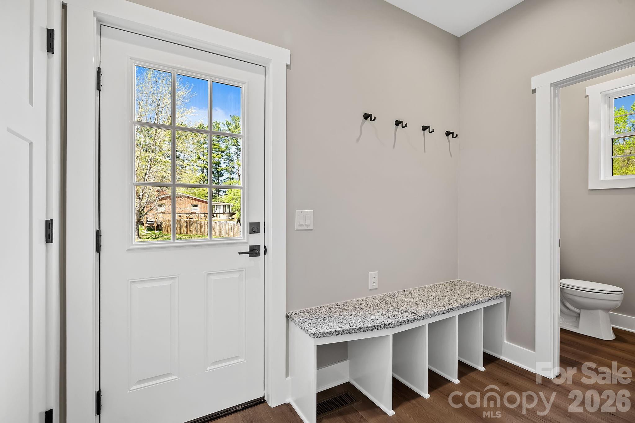 343 Olivette Road Asheville, NC 28804 - Photo 23 of 29 a bathroom with a granite countertop sink a toilet and a window
