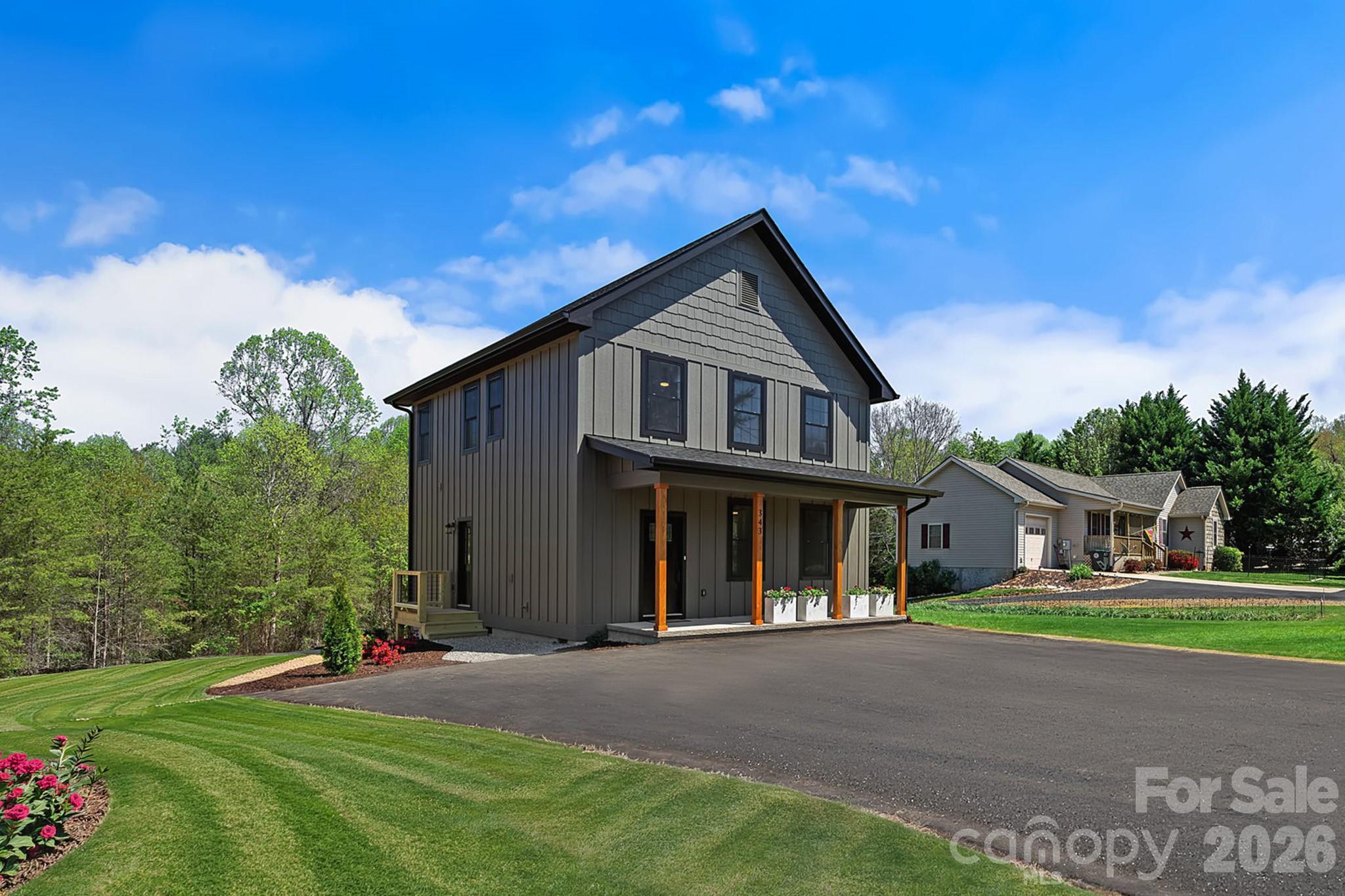 343 Olivette Road Asheville, NC 28804 - Photo 29 of 29 a front view of a house with a yard and garage