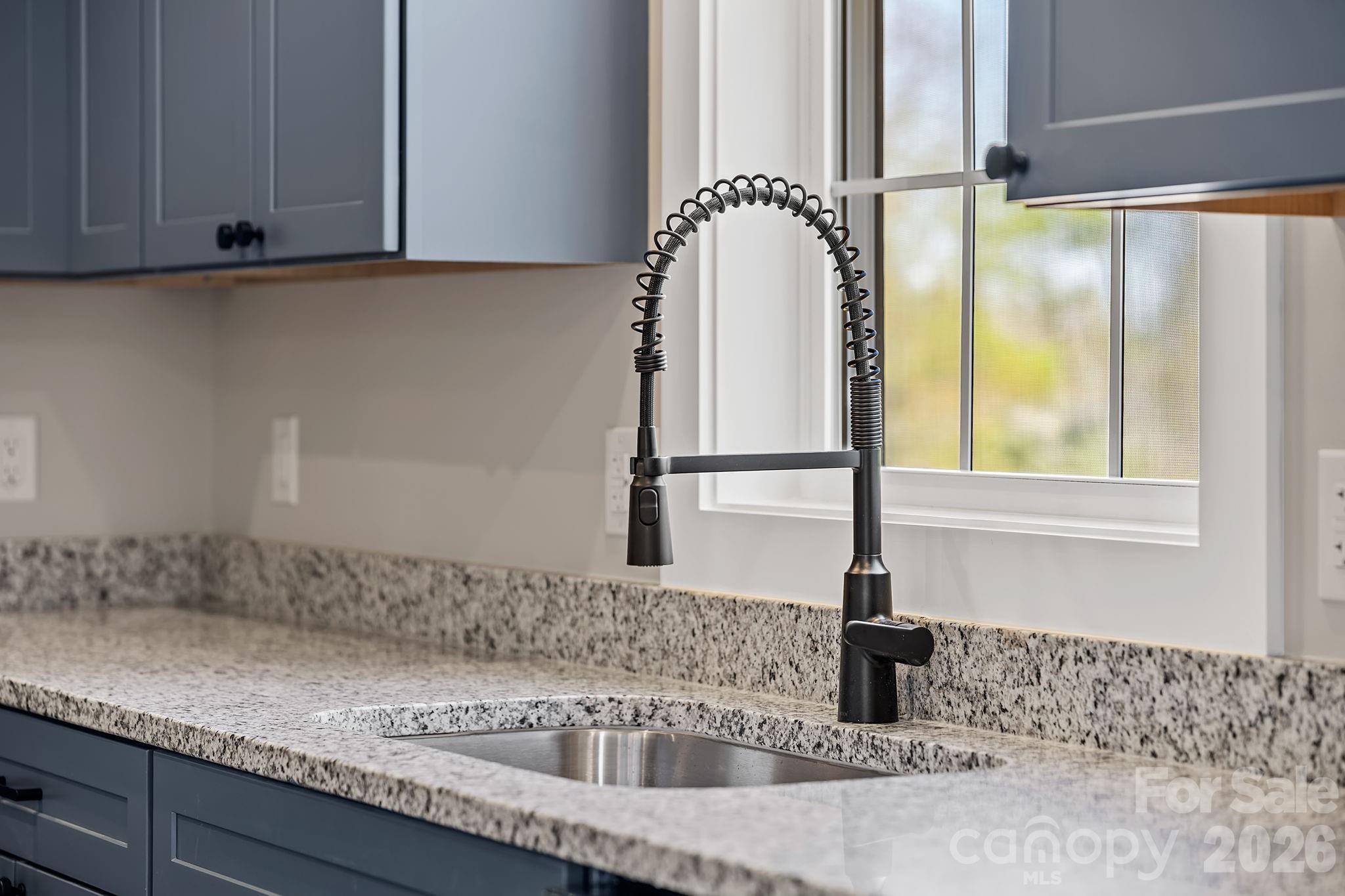 343 Olivette Road Asheville, NC 28804 - Photo 8 of 29 a kitchen with a sink and a window