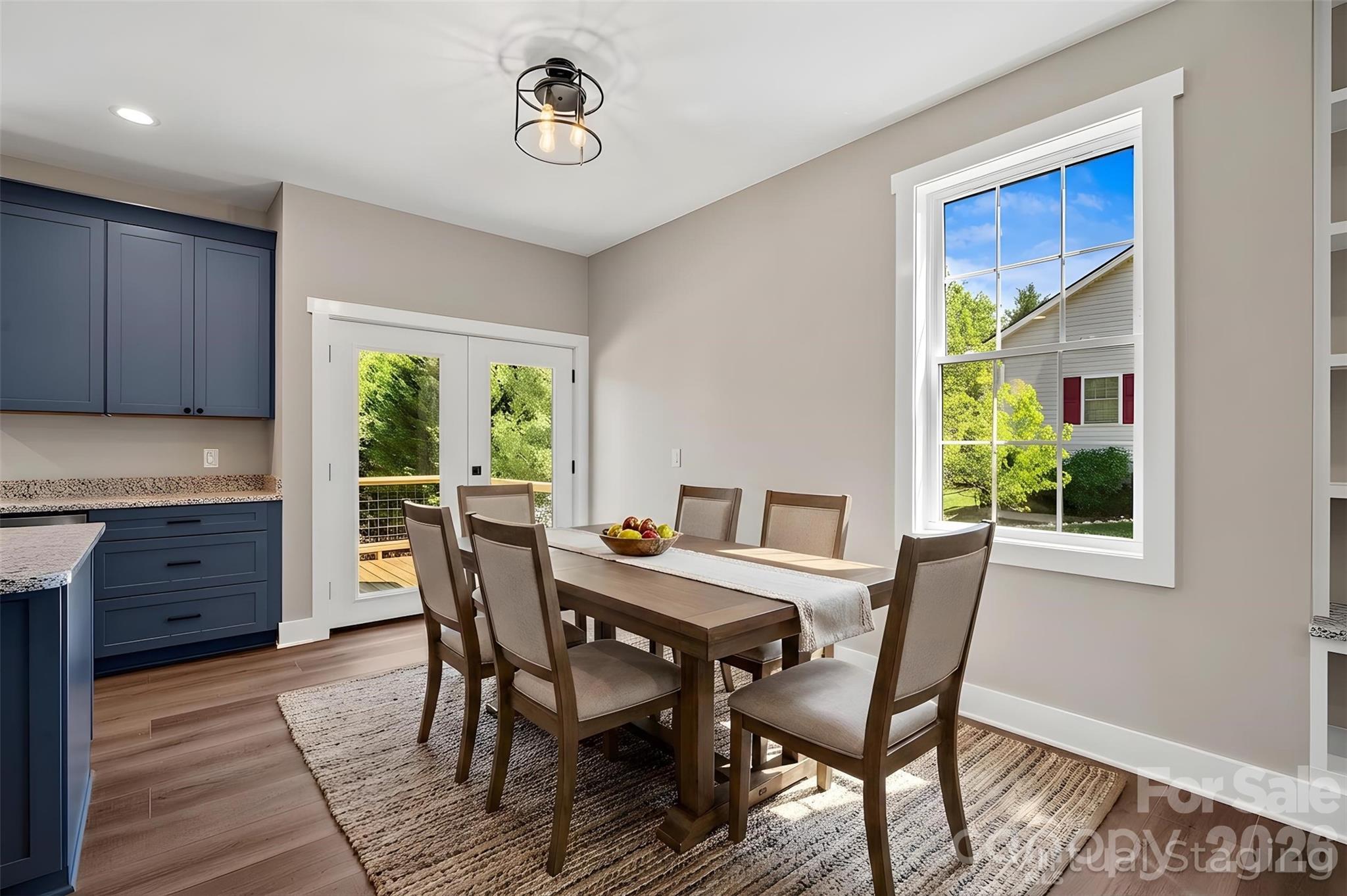 343 Olivette Road Asheville, NC 28804 - Photo 10 of 29 a view of a dining room with furniture window and wooden floor
