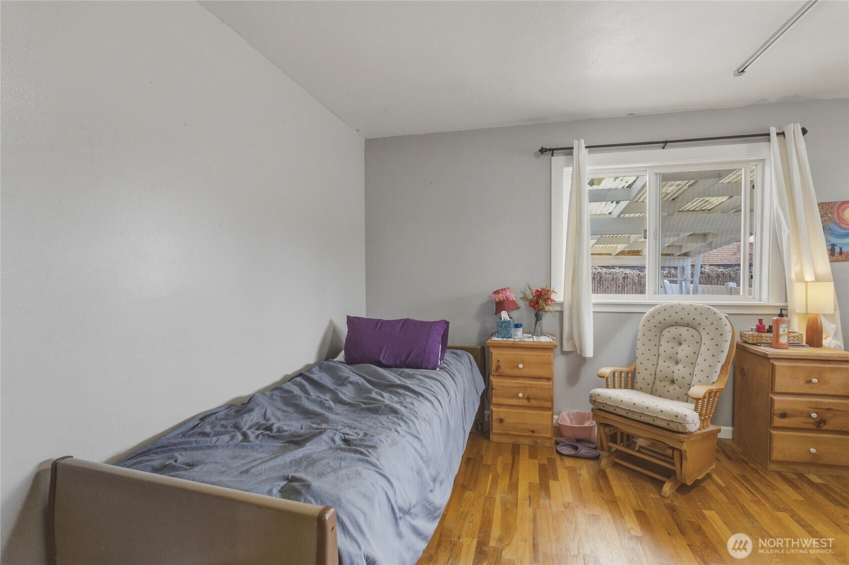 33 North Furney Street Wenatchee, WA 98801 - Photo 15 of 30 a bedroom with a bed and wooden floor