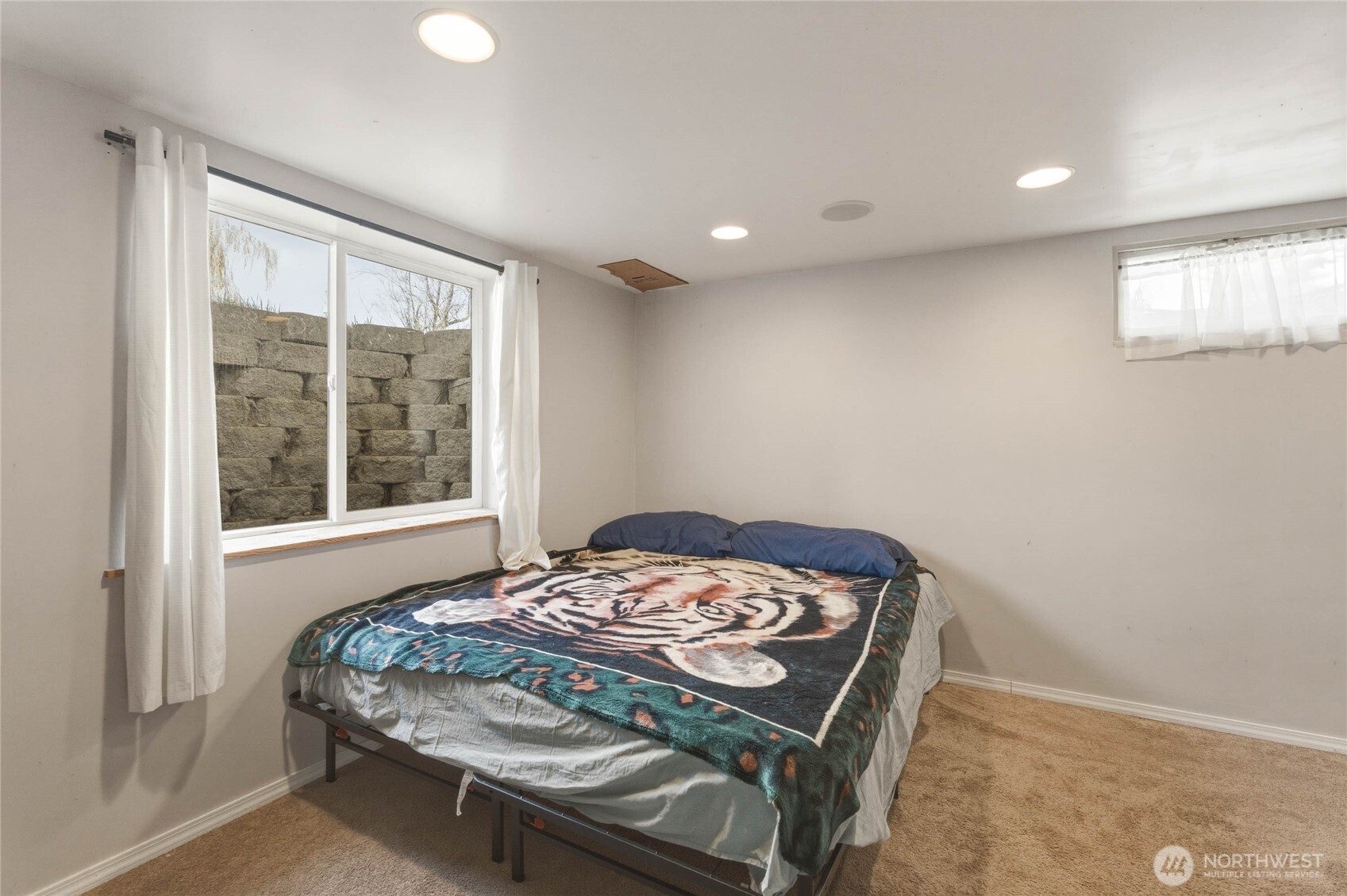 33 North Furney Street Wenatchee, WA 98801 - Photo 16 of 30 a bedroom with a bed and a window