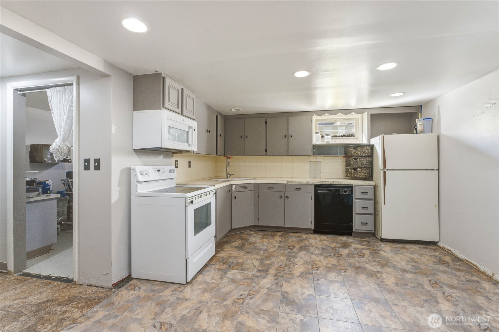 33 North Furney Street Wenatchee, WA 98801 - Photo 20 of 30 a kitchen with a refrigerator sink and cabinets