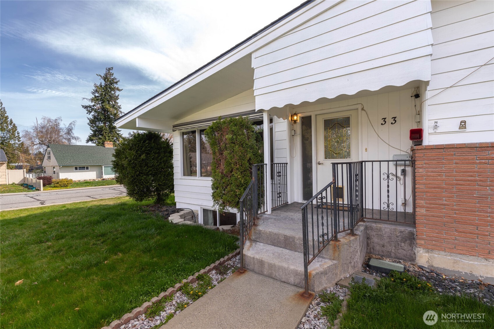 33 North Furney Street Wenatchee, WA 98801 - Photo 3 of 30 a view of a house with backyard and sitting area