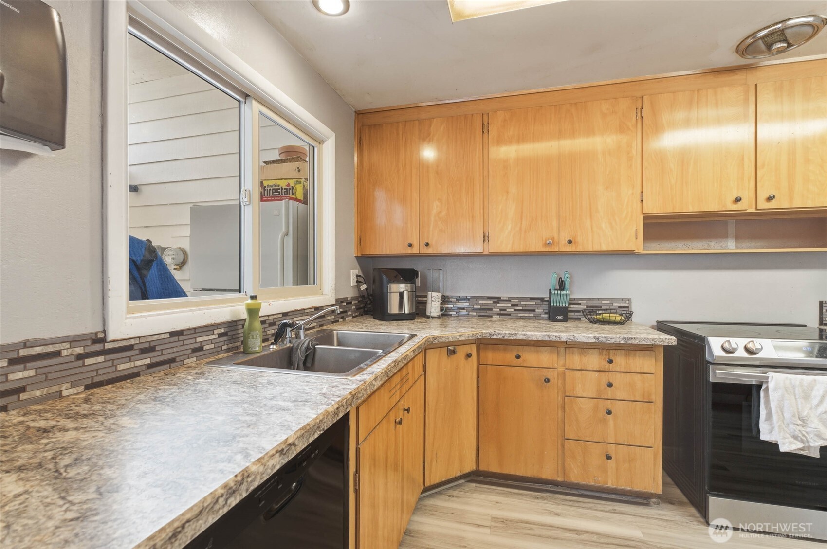 33 North Furney Street Wenatchee, WA 98801 - Photo 7 of 30 a kitchen with granite countertop a sink and cabinets
