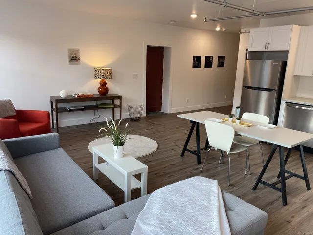 a living room with furniture and a table