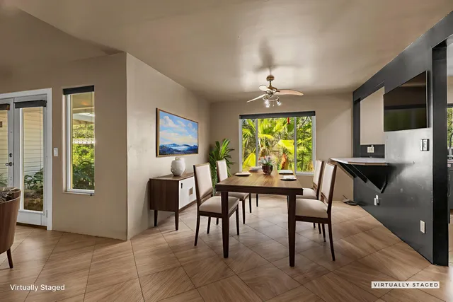 a view of a patio with table and chairs under an umbrella