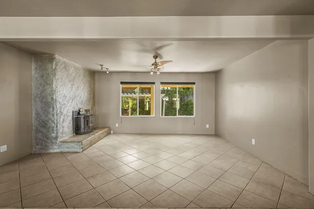 an empty room with windows and entryway