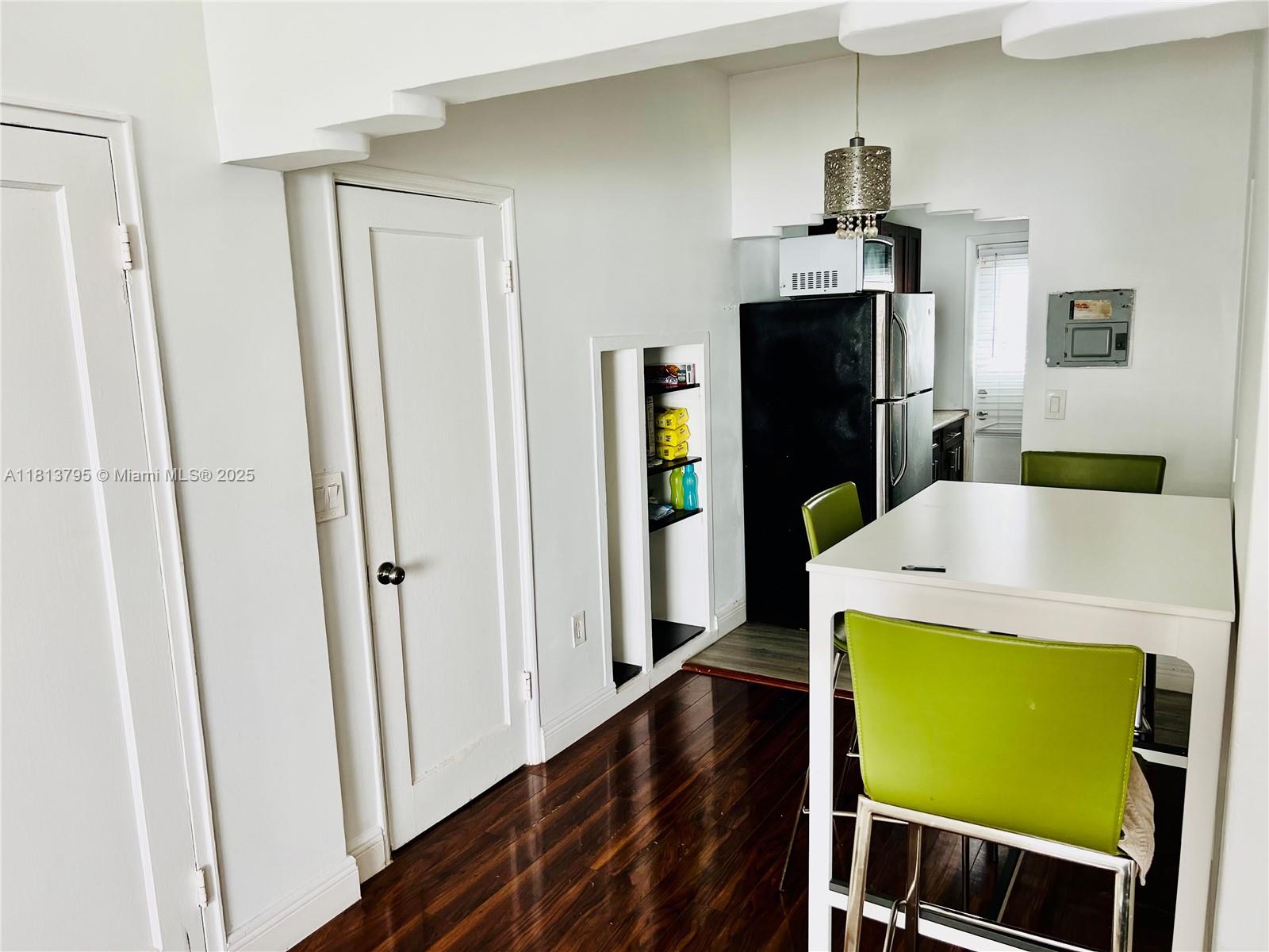 320 80th Street, Unit 6 Miami Beach, FL 33141 - Photo 13 of 33 a view of a living room with furniture and wooden floor