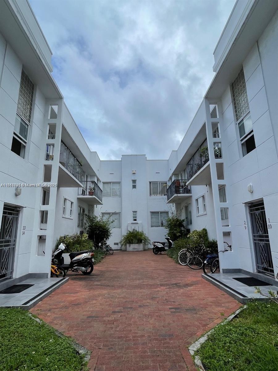 320 80th Street, Unit 6 Miami Beach, FL 33141 - Photo 31 of 33 a cars parked in front of a building