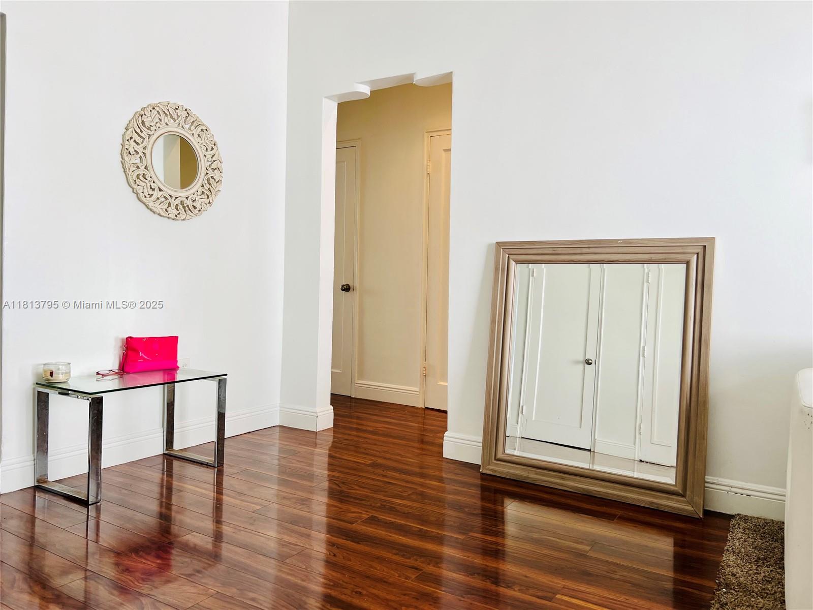 320 80th Street, Unit 6 Miami Beach, FL 33141 - Photo 7 of 33 an entryway with wooden floor