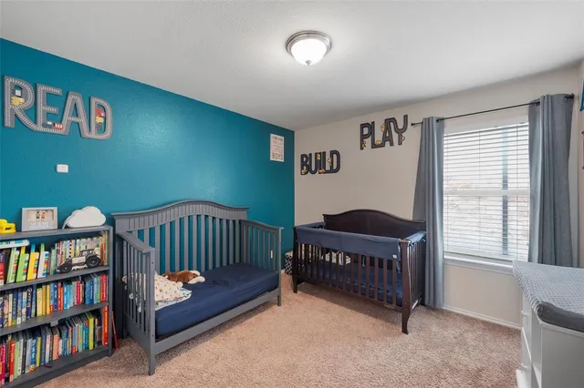 a bathroom with a sink vanity and toilet