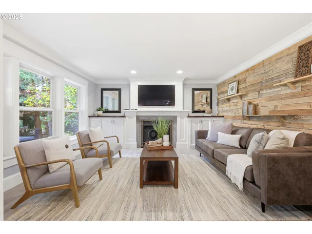 a bedroom with a bed fireplace and window