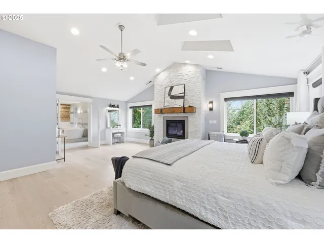 a bedroom with a bed and a mirror