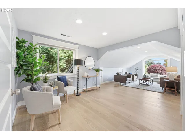 a living room with furniture and a piano