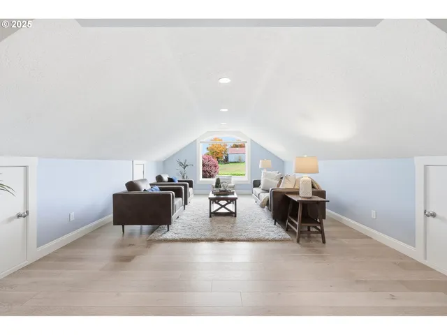 a living room with furniture and a gym machine