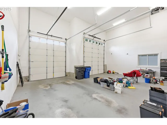 a living room with lots of furniture and a view of kitchen